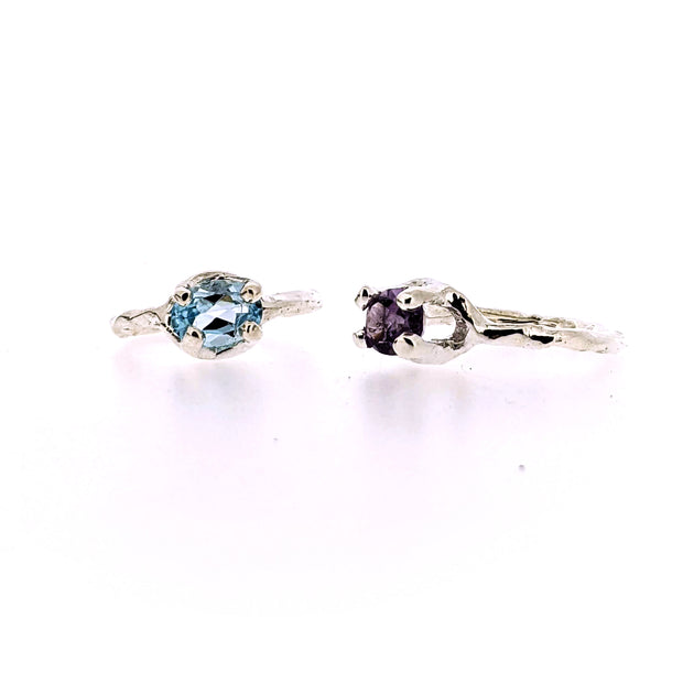 Full view of front and side profile of amethyst and blue topaz Ada Rings.