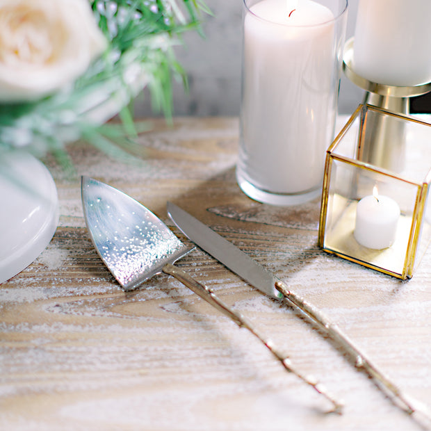 Handmade Sterling and Brass Cake Servers with Branch Handles and Hammered Texture on tabletop decorated for a wedding.  