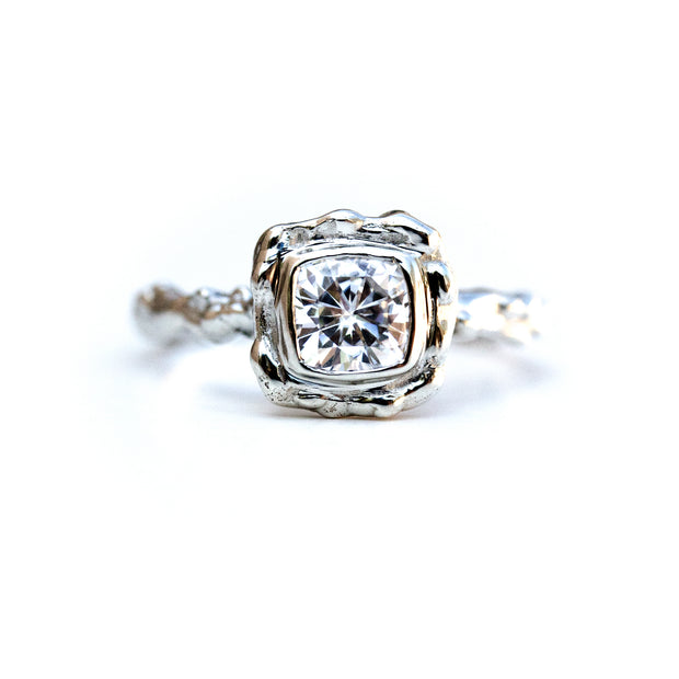 Full view of Elizabeth Ring. This ring is made of silver, has an organic texture, and a set square diamond at the top.