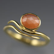 Detail shot of peach moonstone on peach Moonstone Wave Ring.