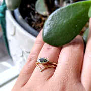 Full view of Olive Ring and V band on woman's hand to help give an idea of its scale.