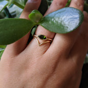 Full view of Olive Ring and V band on woman's hand to help give and idea of its scale