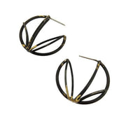 Full image of Small Circle Hoops on white background. These hoops resemble an unfinished circle and are created with architectural motifs in lines. It has a black finish with hints of gold.