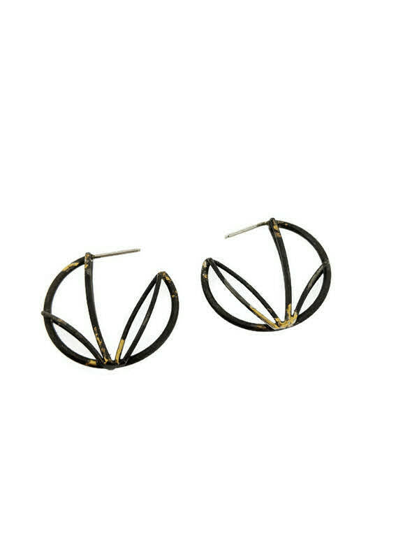 Full image of Small Circle Hoops on white background. These hoops resemble an unfinished circle and are created with architectural motifs in lines. It has a black finish with hints of gold.