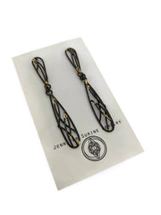 Full image of Oxidized Double Dangling Posts on display card to give idea of scale. These are long dangley earrings that the top resembles an upside down teardrop and the bottom an elongated teardrop created with architectural lines. These earrings have a black finish and hints of gold.