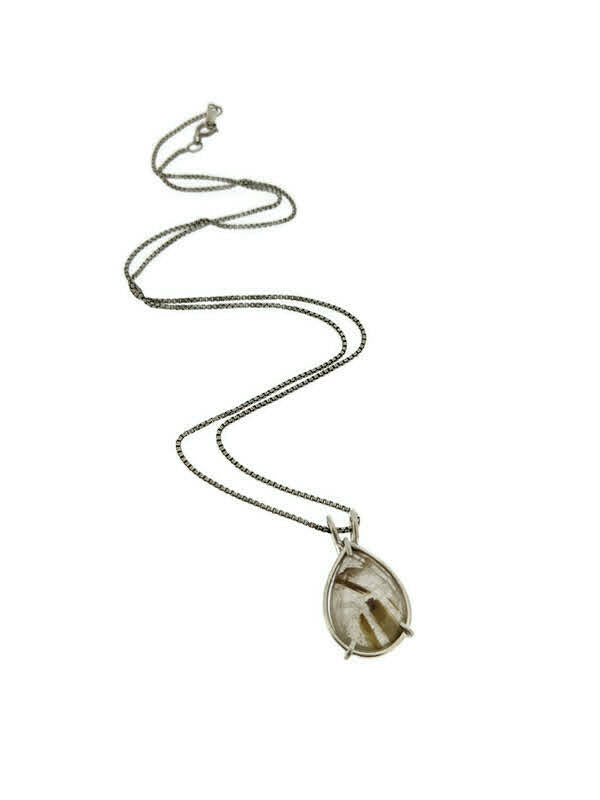 Full image of pendant of Rutilated Quartz Pear Pendant. This pendant has a set rutilated quartz in the shape of a teardrop set in silver.
