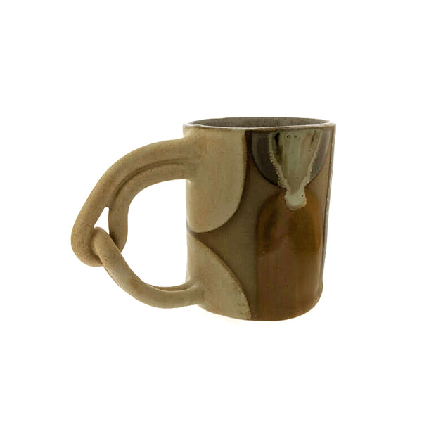 Full image of Pinky Swear Mug made with a variety of tans, whites and creams. This handle is made of two looped cylinders..