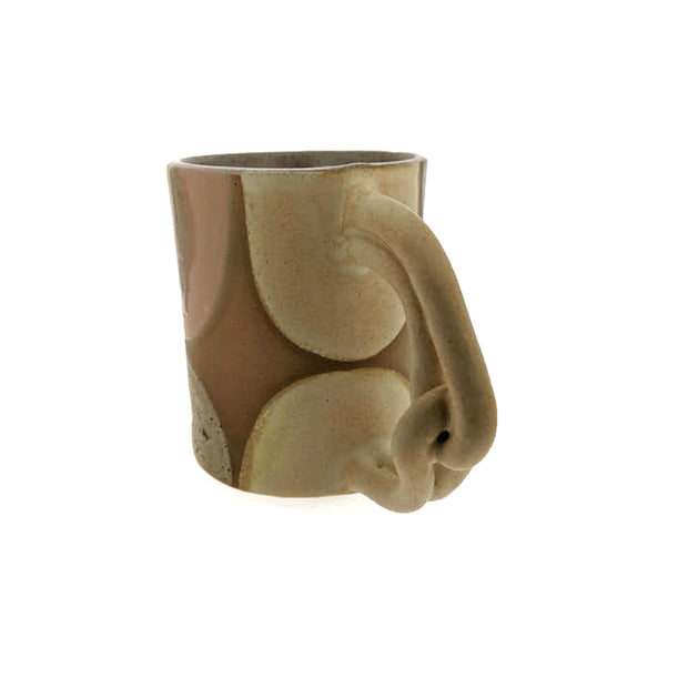 Full image of back of Pinky Swear Mug made with a variety of tans, whites and creams. This handle is made of two looped cylinders..