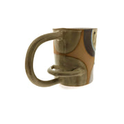 Full image of back of horizontal arch mug on white background. This mug is made with a variety of tans and creams. The handle of the mug is an elongated horizontal arch and has another arch within the handle near the bottom.