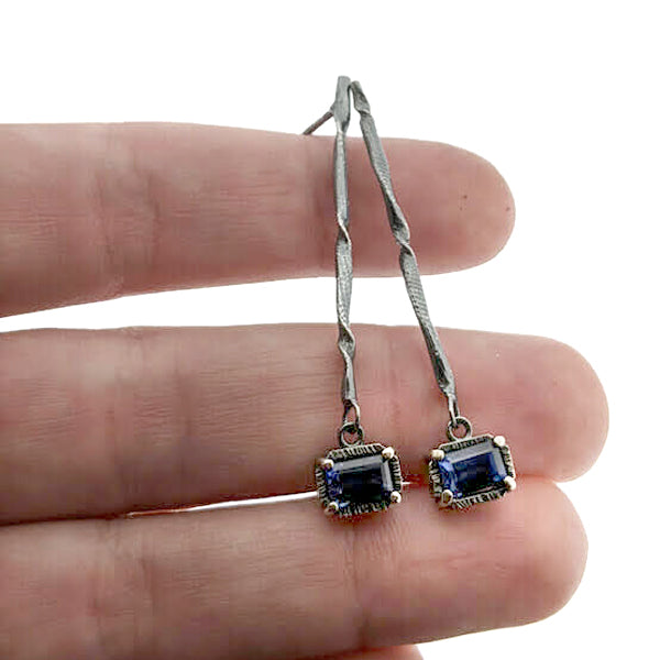 Full view of Blue Sapphire Gina Dangle Earrings being held to help give an idea of their scale.