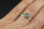 Full image of Montana Blue Sapphire ring on woman's hand to give idea of scale of piece.