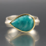 Full view of Amazonite Leaf Ring. This ring has a sideways teardrop of amazonite encompassed in gold on a bulky silver band. The band of this ring resembles that of a leaf.