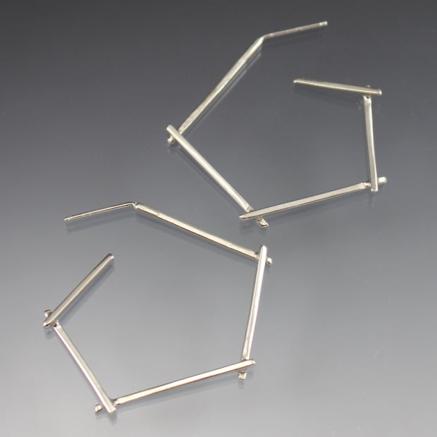 Full view of Small Sticks Hoop Earrings. These hoop earrings are made of silver square wire and resemble sticks when soldered together.