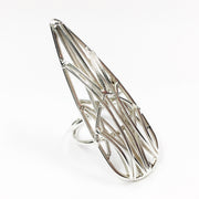 Full image of Medium Teardrop Openwork Ring on a white background. This ring showcases an elongated teardrop that would span from knuckle to knuckle. The shape is created with architectural motifs out of argentium wire.