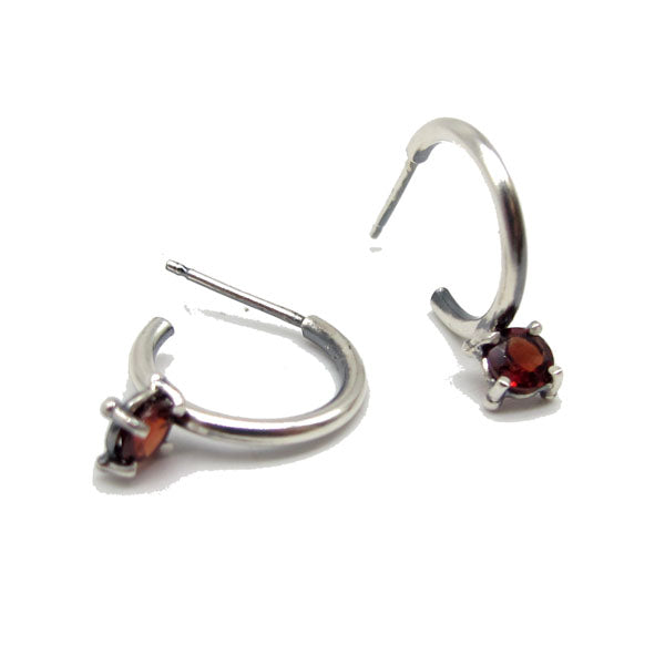 Angled view of front and side view of Garnet Tiny Hoop Earrings.