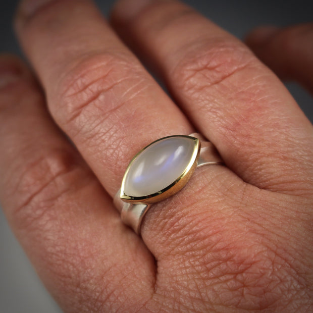 Full image of Moonstone Ridge Ring on woman's finger to help give idea of scale of piece.