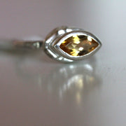 Close up view of precious topaz gemstone on Corinna Ring.
