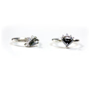 Full view of Penelope Ring and secondary ring sitting next to one another.