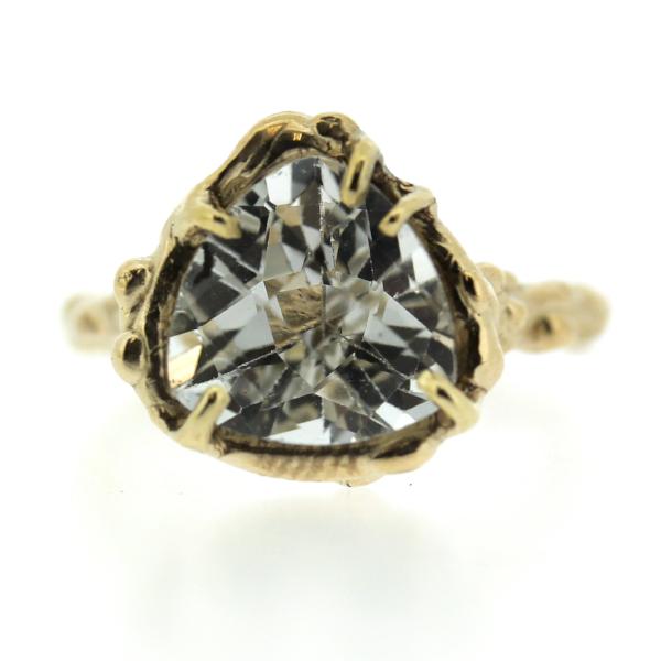 14k yellow gold and Trillion shaped white topaz ring in an organic prong setting