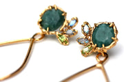 Detail of Organic Rose Cut Emerald and Gold Dangle Earrings with labradorite and peridot accents