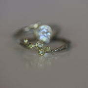 close up view of diamonds flush set in one of a kind organic wedding band
