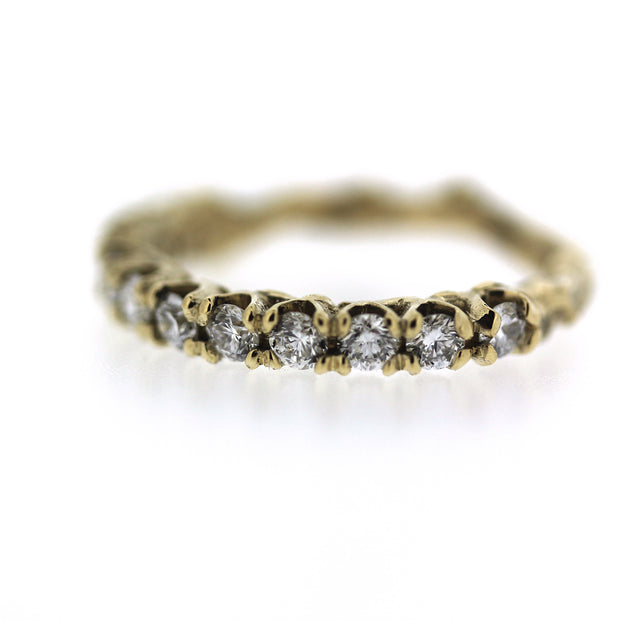 ethically made 2mm diamond engagement half eternity band with unique organic texture and side viewing, detail image of diamonds and prongs