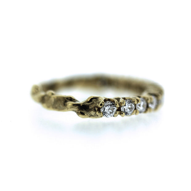 2mm diamond engagement half eternity band with unique organic texture and side viewing, detail shot of end of diamonds and start of textured band