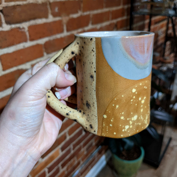 Full image of Criss Cross Mug being held to give idea of scale of piece.