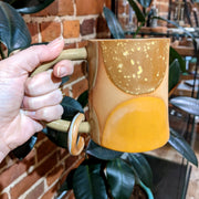 Full image of Ring Mug being held to help give idea of scale of piece.