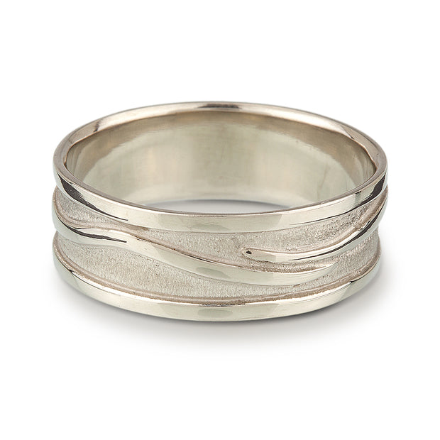 Full image of Men's Wave Band in silver. This is a thick banded ring that has a design of a swerving line through it that resembles a wave.