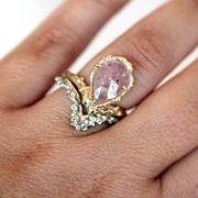 unique alternative engagement ring set featuring pink sapphire and organic texture