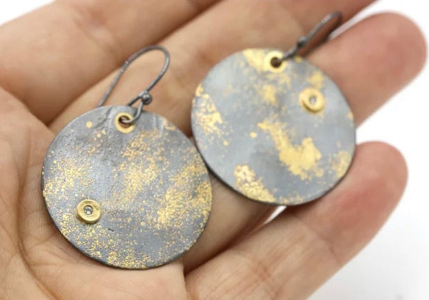Close up image of Fused Lichen Full Moon Disc Diamond Accent Earrings with hand in background to give an idea of scale of earrings.