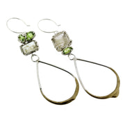 Slightly asymmetrical earrings handmade in sterling, rutilated quartz and peridot, a mismatched pair by Katie Poterala Studio