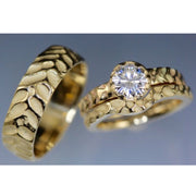 Full view of Contoured Cobblestone Ring with its matching engagement ring and partners thicker wedding band. 