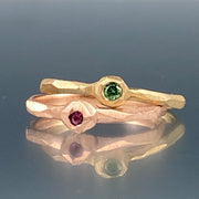 Full image of green diamond and pink sapphire nugget facet rings.