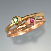 Full image of green diamond and pink sapphire nugget facet rings stacked together.