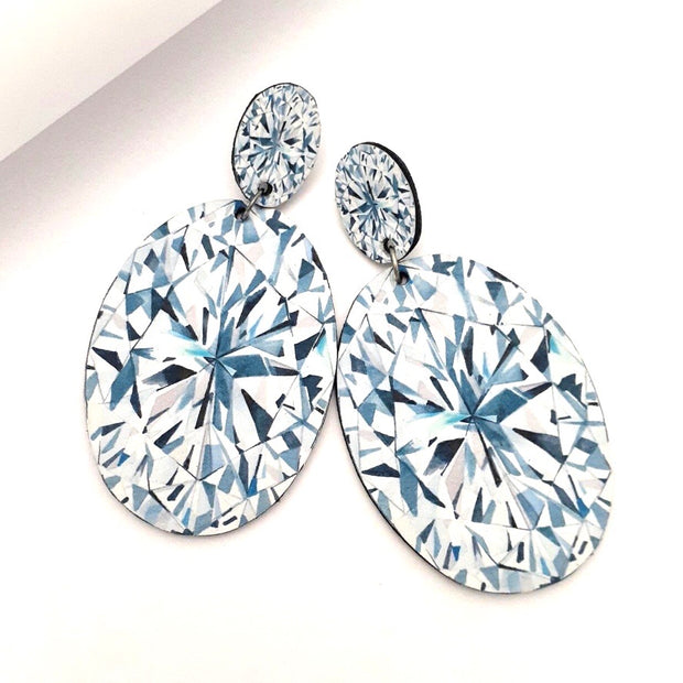 Full view of Oval Shaped Diamond Illustration - large Drop Earring on white background.