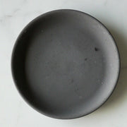 Fill image of circle round, grey, concrete jewelry dish.