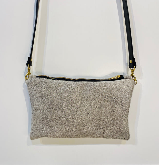 Full image of grey Wylie cross body bag on white background.