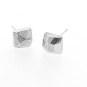 Angled view of square faceted stud earrings.