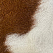 Close up image of brown and white fur on Wylie cross body bag.