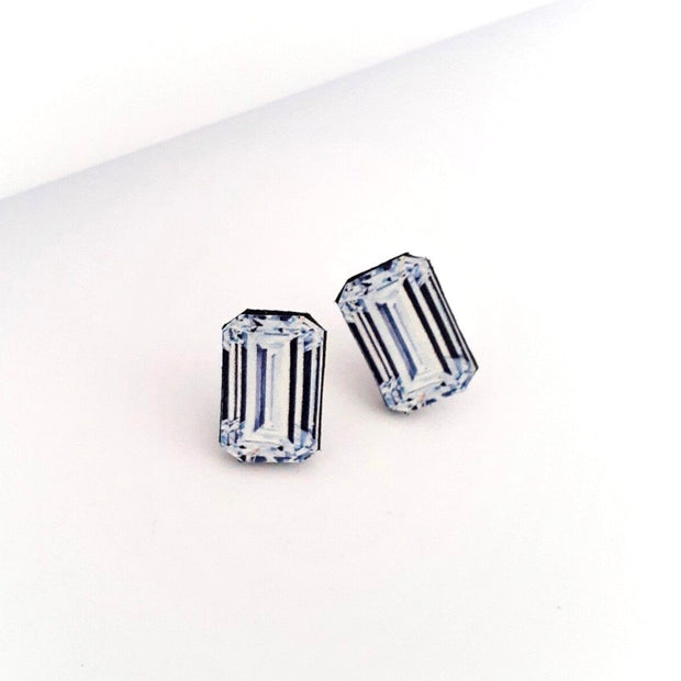 Full view of Emerald Cut Diamond Illustration - Stud Earring. These statement studs are actually an illustration of Emerald Cut Diamonds!