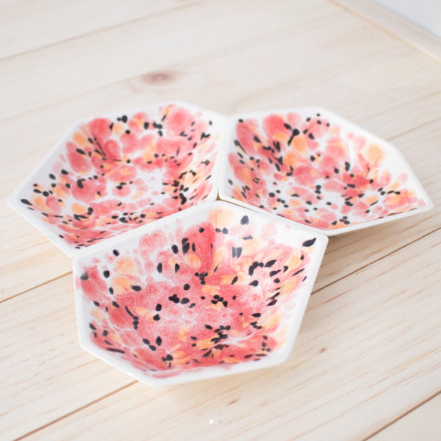 Full image of all three geometric ring dishes placed together with poppy design.