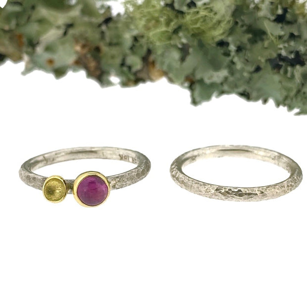 Full view of both Luxe Lichen Stacking Ring Set - Pink Sapphire sitting next to one another with moss in the bcakground.