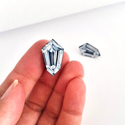 Full view of Kite Shaped Diamond Illustration - Stud Earring being held to help give an idea of its scale.