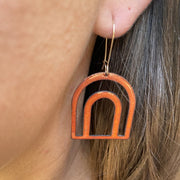 Detail shot of earrings being worn to help give idea of their scale.