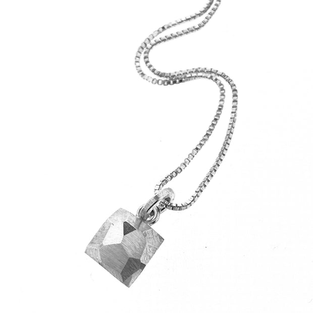full view of square pendant on silver chain.