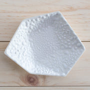 Full image of porcelain geometric white ring dish with added beads of white that look like rain droplets.