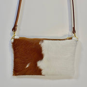 Full image of brown and white Wylie cross body bag on white background.