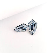 Full view of one standing and the other laying down of Kite Shaped Diamond Illustration - Stud Earrings. These statement studs are actually an illustration of fancy Kite or Shield Shaped Diamonds!